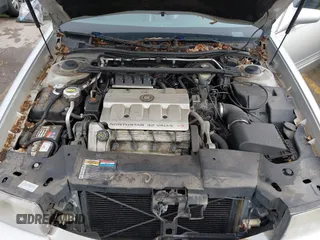 1999 Cadillac DeVille z VIN 1G6KD54Y6XU734741, wystawiony jako IAAI lot #42121114 z przebiegiem 152 829 mil mil oraz . Historia ofert i sprzedaży dostępna na DreamBid. Obrazek 10.