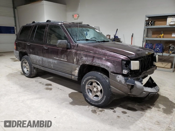 1997 Jeep Grand Cherokee Laredo with VIN 1J4GZ58S6VC573007, listed as a Copart auction lot 42728355 with 164,269 mi miles and Salvage Title. Bid and sale history available at carsss.com. Image 4.