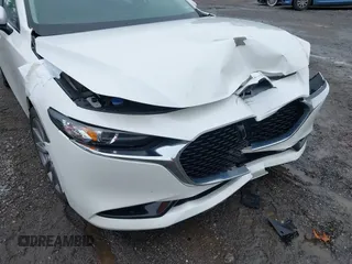 2021 Mazda 3 Preferred z VIN 3MZBPBCL0MM250862, wystawiony jako IAAI lot #42318612 z przebiegiem 86 056 mil mil oraz . Historia ofert i sprzedaży dostępna na DreamBid. Obrazek 18.