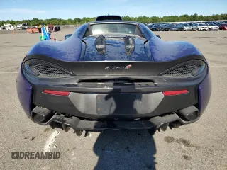 2018 McLaren 570S z VIN SBM13FAA8JW005006, wystawiony jako Copart lot #59641834 z przebiegiem 38 683 mil mil oraz Szkody całkowita. Historia ofert i sprzedaży dostępna na DreamBid. Obrazek 6.