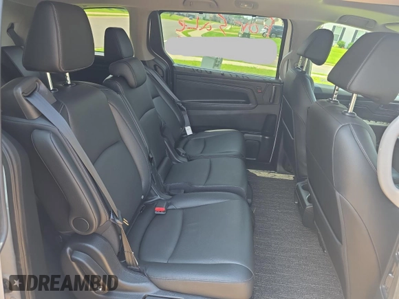 2023 Honda Odyssey EX-L z VIN 5FNRL6H67PB013527, wystawiony jako Copart lot #59705385 z przebiegiem 12 262 mil mil oraz Czysty tytuł • Clean title. Historia ofert i sprzedaży dostępna na DreamBid. Obrazek 6.
