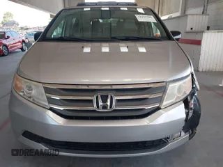 2012 Honda Odyssey EX-L with VIN 5FNRL5H67CB005013, listed as a IAAI auction lot 42295586 with 200,611 mi miles and . Bid and sale history available at DreamBid. Image 12.