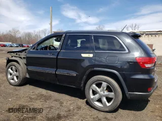 2013 Jeep Grand Cherokee Overland with VIN 1C4RJFCT2DC576125, listed as a Copart auction lot 52595165 with 100,361 mi miles and Salvage Title. Bid and sale history available at carsss.com. Image 2.