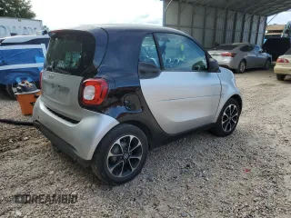 2016 Smart fortwo Passion z VIN WMEFJ5DA6GK057472, wystawiony jako Copart lot #74035244 z przebiegiem 67 826 mil mil oraz Szkoda całkowita • Salvage title. Historia ofert i sprzedaży dostępna na DreamBid. Obrazek 3.