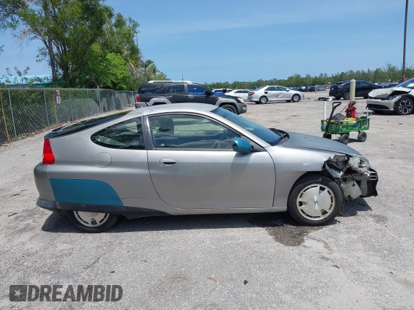 2004 Honda Insight z VIN JHMZE14744T000527, wystawiony jako IAAI lot #42378630 z przebiegiem 1 360 mil mil oraz . Historia ofert i sprzedaży dostępna na DreamBid. Obrazek 13.