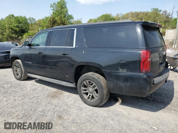 2019 Chevrolet Suburban LT with VIN 1GNSCHKC2KR167309, listed as a Copart auction lot 54475565 with 140,552 mi miles and Salvage Title. Bid and sale history available at DreamBid. Image 2.