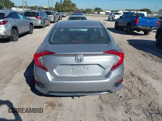 2020 Honda Civic LX with VIN 19XFC2F62LE009433, listed as a IAAI auction lot 40963670 with 117,865 mi miles and . Bid and sale history available at DreamBid. Image 16.