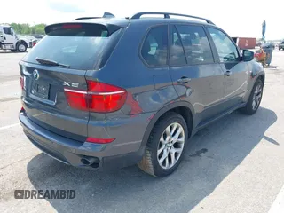 2011 BMW X5 35i with VIN 5UXZV4C57BL739907, listed as a IAAI auction lot 42135572 with 0 mi miles. Bid and sale history available at carsss.com. Image 4.