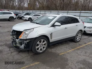 2014 Cadillac SRX Premium Collection z VIN 3GYFNDE34ES548826, wystawiony jako IAAI lot #40792942 z przebiegiem 115 984 mil mil oraz . Historia ofert i sprzedaży dostępna na DreamBid. Obrazek 2.