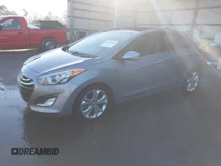 2014 Hyundai Elantra GT with VIN KMHD35LH1EU162934, listed as a IAAI auction lot 41705866 with 121,709 mi miles. Bid and sale history available at carsss.com. Image 2.