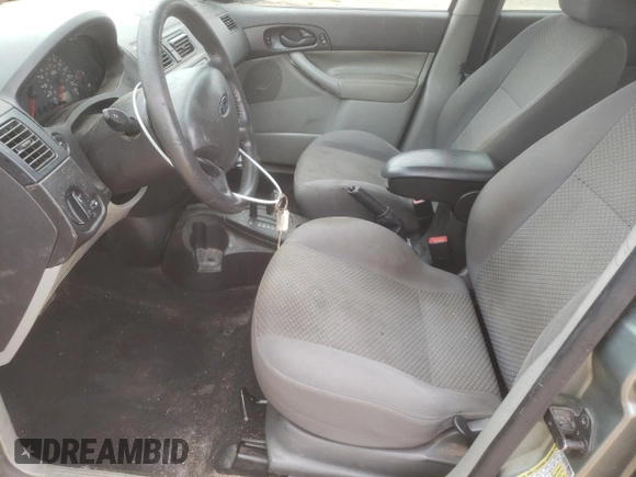 2006 Ford Focus S with VIN 1FAHP37N76W180039, listed as a Copart auction lot 58328565 with 220,696 mi miles and Salvage title. Bid and sale history available at DreamBid. Image 7.