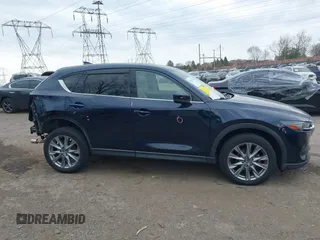 2021 Mazda CX-5 Grand Touring with VIN JM3KFADM0M1321375, listed as a IAAI auction lot 41913449 with 88,178 mi miles. Bid and sale history available at carsss.com. Image 14.
