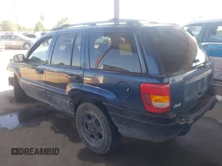 2000 Jeep Grand Cherokee Laredo with VIN 1J4G248SXYC274865, listed as a IAAI auction lot 42542922 with 185,902 mi miles and . Bid and sale history available at DreamBid. Image 3.