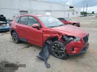 2016 Mazda CX-5 Grand Touring with VIN JM3KE4DY0G0664379, listed as a Copart auction lot 54659005 with 116,022 mi miles and Salvage Title. Bid and sale history available at DreamBid. Image 4.