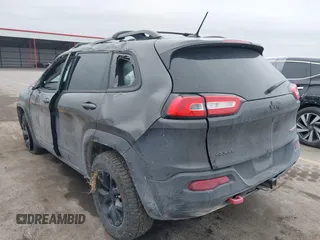 2015 Jeep Cherokee Trailhawk with VIN 1C4PJMBS0FW668730, listed as a IAAI auction lot 41462037 with 83,454 mi miles. Bid and sale history available at carsss.com. Image 3.