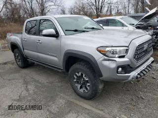 2018 Toyota Tacoma SR z VIN 3TMCZ5AN2JM122416, wystawiony jako Copart lot #61351225 z przebiegiem Nie podano mil oraz Szkoda całkowita • Salvage title. Historia ofert i sprzedaży dostępna na DreamBid. Obrazek 4.