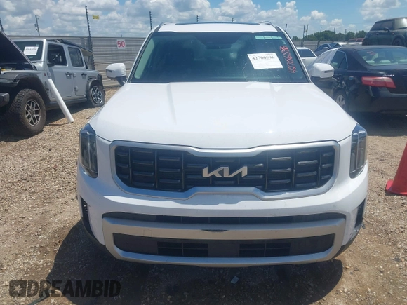 2025 Kia Telluride S with VIN 5XYP6DGC0SG590900, listed as a IAAI auction lot 42706596 with 6,712 mi miles and . Bid and sale history available at DreamBid. Image 12.