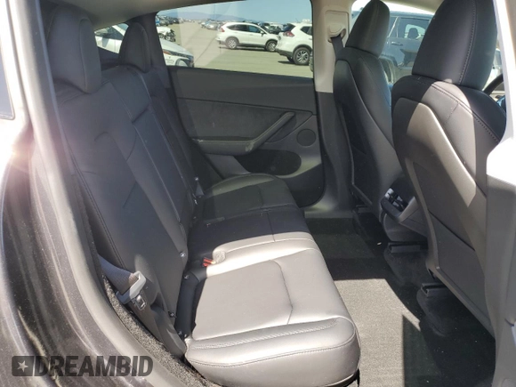 2025 Tesla Model Y Long Range with VIN 7SAYGDED4SF240354, listed as a Copart auction lot 52049745 with 6,785 mi miles and Salvage Title. Bid and sale history available at DreamBid. Image 10.