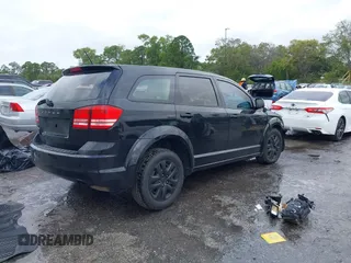 2014 Dodge Journey American Value Pkg with VIN 3C4PDCAB9ET170601, listed as a IAAI auction lot 41197807 with Not Provided miles. Bid and sale history available at carsss.com. Image 4.