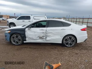 2019 Ford Fusion Titanium with VIN 3FA6P0D93KR138574, listed as a IAAI auction lot 41967094 with 118,297 mi miles. Bid and sale history available at carsss.com. Image 14.
