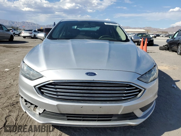 2018 Ford Fusion SE z VIN 3FA6P0LU7JR139974, wystawiony jako Copart lot #69819394 z przebiegiem 164 123 mil mil oraz Szkoda całkowita • Salvage title. Historia ofert i sprzedaży dostępna na DreamBid. Obrazek 5.