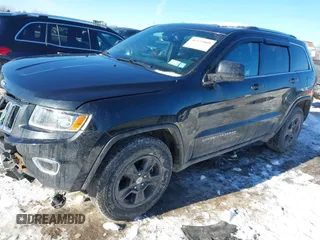 2014 Jeep Grand Cherokee Laredo with VIN 1C4RJFAG7EC109564, listed as a IAAI auction lot 41373860 with 144,869 mi miles. Bid and sale history available at carsss.com. Image 2.