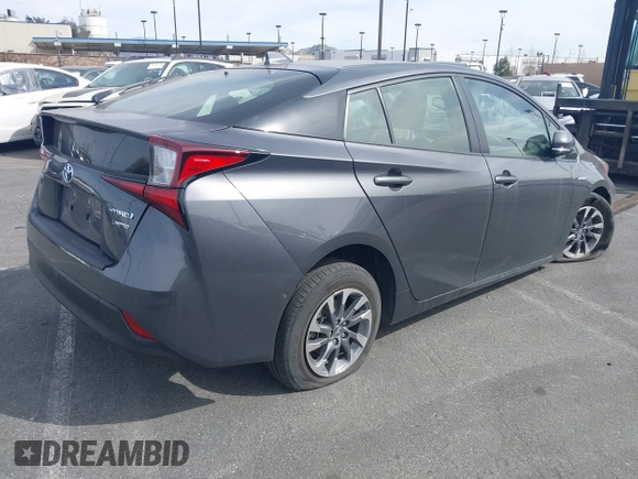 2020 Toyota Prius L Eco z VIN JTDKARFU9L3104882, wystawiony jako IAAI lot #41243035 z przebiegiem 29 013 mil mil oraz . Historia ofert i sprzedaży dostępna na DreamBid. Obrazek 4.