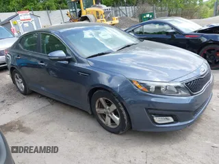 2015 Kia Optima LX z VIN KNAGM4A72F5580043, wystawiony jako IAAI lot #42278035 z przebiegiem 92 518 mil mil oraz . Historia ofert i sprzedaży dostępna na DreamBid. Obrazek 1.