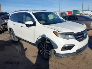 2017 Honda Pilot Touring z VIN 5FNYF6H93HB056387, wystawiony jako IAAI lot #41095336 z przebiegiem 90 376 mil mil oraz . Historia ofert i sprzedaży dostępna na DreamBid. Obrazek 1.