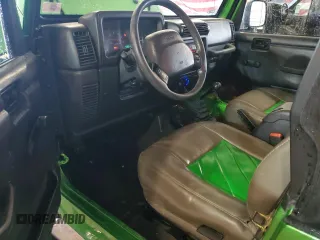 2002 Jeep Wrangler Sport with VIN 1J4FA49S72P701075, listed as a Copart auction lot 66894914 with 169,971 mi miles and Salvage Title. Bid and sale history available at carsss.com. Image 8.