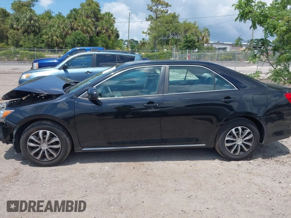 2014 Toyota Camry L with VIN 4T4BF1FKXER402857, listed as a IAAI auction lot 42144757 with 192,081 mi miles and . Bid and sale history available at DreamBid. Image 13.