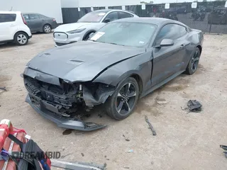 2021 Ford Mustang EcoBoost with VIN 1FA6P8TH1M5152941, listed as a IAAI auction lot 42110646 with 26,673 mi miles and . Bid and sale history available at DreamBid. Image 2.