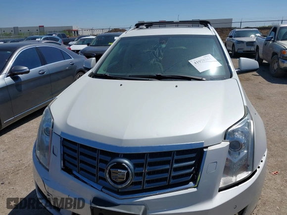 2014 Cadillac SRX Performance Collection with VIN 3GYFNFE35ES582897, listed as a IAAI auction lot 41978361 with 144,116 mi miles and . Bid and sale history available at DreamBid. Image 12.