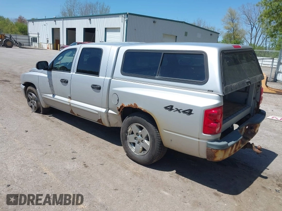 2005 Dodge Dakota SLT with VIN 1D7HW48N45S321002, listed as a IAAI auction lot 42240338 with 214,983 mi miles and . Bid and sale history available at DreamBid. Image 3.