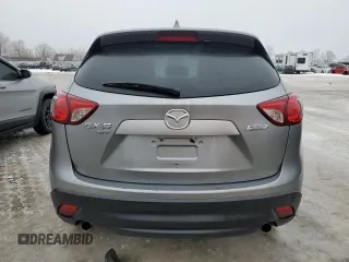 2015 Mazda CX-5 Sport with VIN JM3KE4BEXF0499688, listed as a Copart auction lot 88988095 with 258,460 mi miles and Salvage title. Bid and sale history available at DreamBid. Image 6.