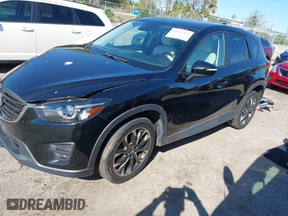 2016 Mazda CX-5 Grand Touring with VIN JM3KE4DY4G0677605, listed as a IAAI auction lot 41642893 with Not Provided miles and . Bid and sale history available at carsss.com. Image 2.