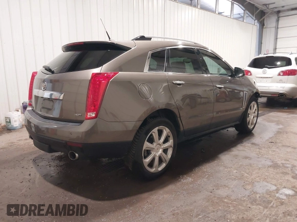 2014 Cadillac SRX Performance Collection z VIN 3GYFNFE38ES578066, wystawiony jako IAAI lot #42153023 z przebiegiem 134 009 mil mil oraz . Historia ofert i sprzedaży dostępna na DreamBid. Obrazek 4.