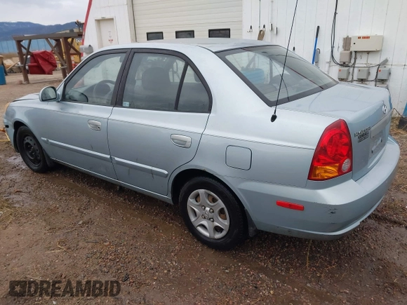 2003 Hyundai Accent GL z VIN KMHCG45C43U465523, wystawiony jako IAAI lot #40883056 z przebiegiem 95 770 mil mil oraz . Historia ofert i sprzedaży dostępna na DreamBid. Obrazek 3.