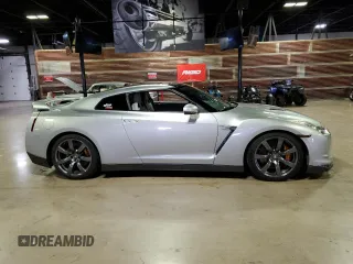 2009 Nissan GT-R Premium z VIN JN1AR54F89M252013, wystawiony jako Copart lot #70656764 z przebiegiem 66 085 mil mil oraz Szkody całkowita. Historia ofert i sprzedaży dostępna na DreamBid. Obrazek 1.