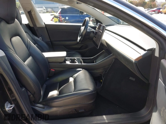 2019 Tesla Model 3 Mid Range with VIN 5YJ3E1EA2KF305834, listed as a IAAI auction lot 41719610 with 126,333 mi miles and . Bid and sale history available at DreamBid. Image 5.