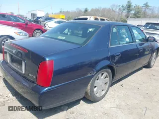2002 Cadillac DeVille DTS with VIN 1G6KF57912U205527, listed as a IAAI auction lot 42064174 with 135,002 mi miles. Bid and sale history available at carsss.com. Image 4.
