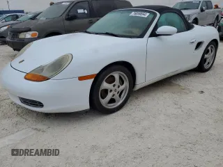 1998 Porsche Boxster z VIN WP0CA2987WU623387, wystawiony jako Copart lot #76859594 z przebiegiem Nie podano mil oraz Szkoda całkowita • Salvage title. Historia ofert i sprzedaży dostępna na DreamBid. Obrazek 1.