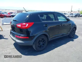 2013 Kia Sportage LX with VIN KNDPBCA25D7449584, listed as a IAAI auction lot 42489414 with 100,993 mi miles and . Bid and sale history available at DreamBid. Image 4.