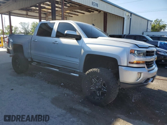 2017 Chevrolet Silverado 1500 LT with VIN 3GCUKREC0HG470703, listed as a Copart auction lot 53667145 with 167,689 mi miles and Salvage Title. Bid and sale history available at DreamBid. Image 4.