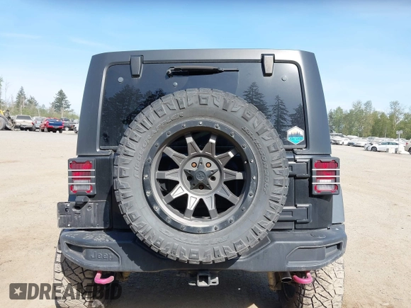 2015 Jeep Wrangler Unlimited Willys Wheeler with VIN 1C4BJWDG9FL750049, listed as a IAAI auction lot 42136188 with 115,328 mi miles and . Bid and sale history available at DreamBid. Image 17.