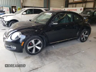 2012 Volkswagen Beetle 2.0T Turbo with VIN 3VWV67AT7CM652862, listed as a Copart auction lot 70655994 with 53,664 mi miles and Salvage Title. Bid and sale history available at carsss.com. Image 1.