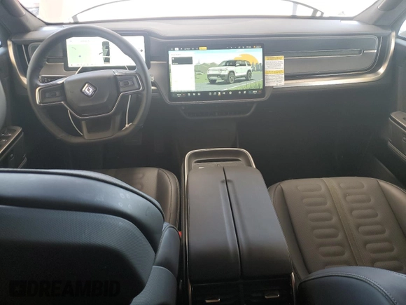 2025 Rivian R1S Adventure z VIN 7PDSGBBA9SN052652, wystawiony jako Copart lot #51659315 z przebiegiem 4012 mil mil oraz Szkody całkowita. Historia ofert i sprzedaży dostępna na DreamBid. Obrazek 8.
