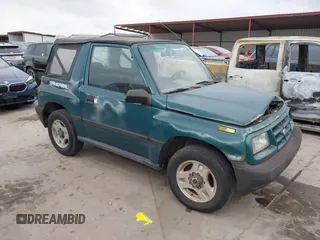 1997 Chevrolet Tracker z VIN 2CNBJ1864V6904934, wystawiony jako IAAI lot #41512446 z przebiegiem 223 032 mil mil oraz . Historia ofert i sprzedaży dostępna na DreamBid. Obrazek 1.