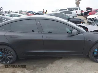 2019 Tesla Model 3 Mid Range with VIN 5YJ3E1EA8KF538083, listed as a IAAI auction lot 41891458 with 46,958 mi miles and . Bid and sale history available at carsss.com. Image 13.