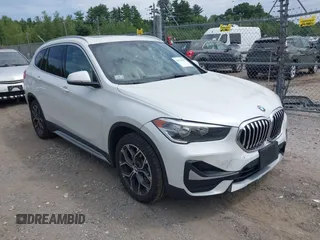2021 BMW X1 xDrive28i with VIN WBXJG9C07M5U21337, listed as a IAAI auction lot 42590859 with 35,934 mi miles and . Bid and sale history available at DreamBid. Image 1.